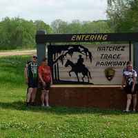 Mississippi - Four cyclists at the Southern Terminus of the Natchez Trace Parkway.