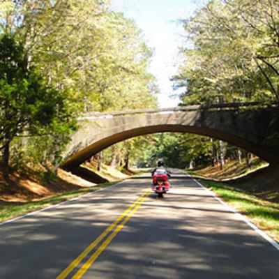 Motorcycle passing under the Highway 27 overpass on the Natchez Trace Parkway.