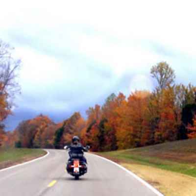 Motorcyclist enjoying fall foliage near Water Valley Overlook and milepost 413.