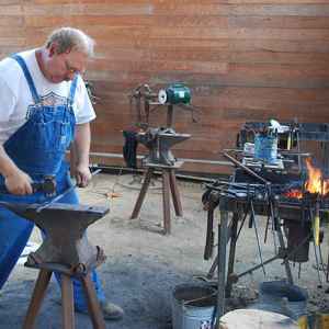 Blacksmith demonstrating his craft at the Mississippi Crafts Center.