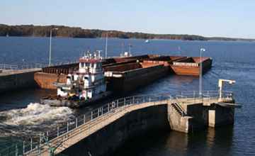 A barge going through the lock out onto Bay Springs Lake.